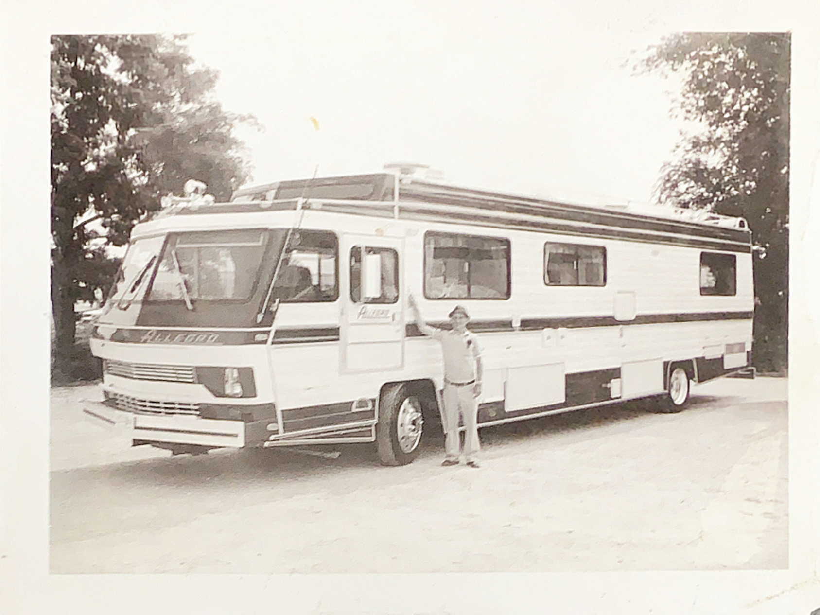Family camping under starlight near RV